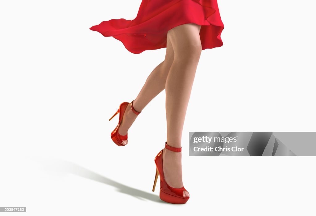 Woman wearing red dress and heels