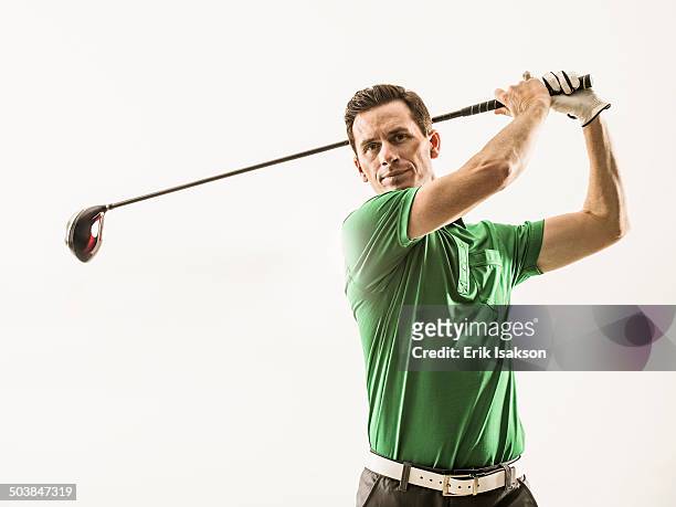 caucasian man playing golf - man studio shot stock pictures, royalty-free photos & images