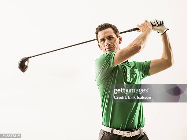 caucasian man playing golf - golf swing imagens e fotografias de stock