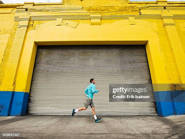 Man Rushing Out A Door Man Running Through Door Photos and Premium High Res Pictures - Getty ...