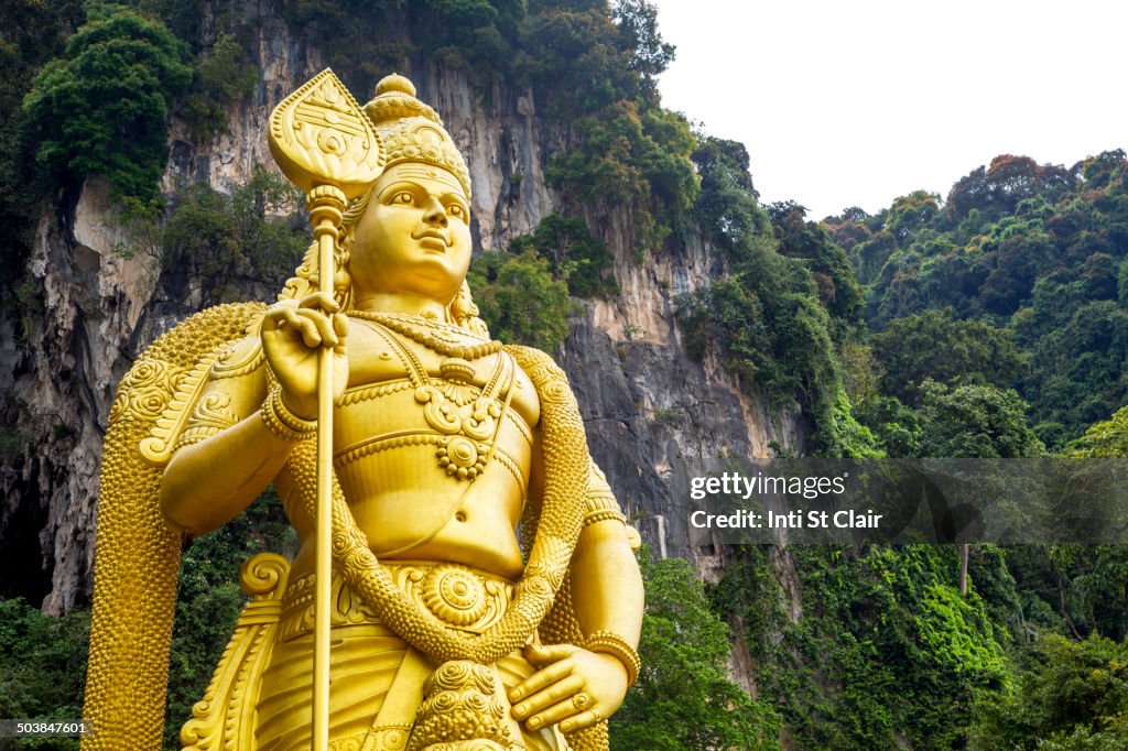 Gold statue of Murugan outside Batu Caves, Kuala Lumpur, Selangor, Malaysia