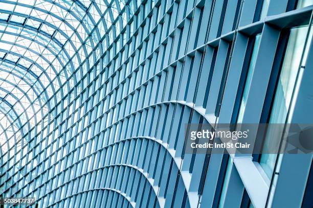 close up of curved metal and glass building - architectural feature stock pictures, royalty-free photos & images