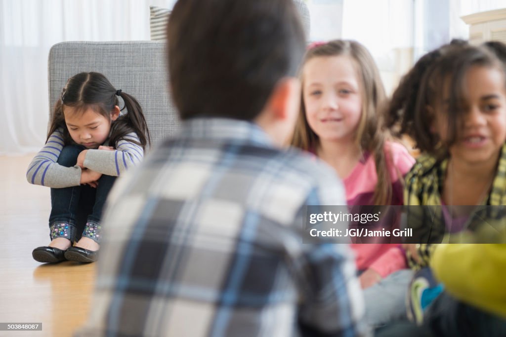 Children excluding girl in group