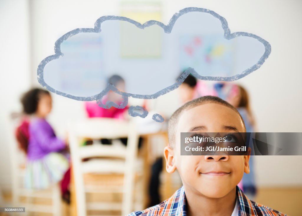 Boy with thought bubble over his head