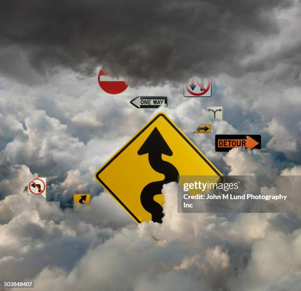 road signs in cloudy sky - detour stock pictures, royalty-free photos & images