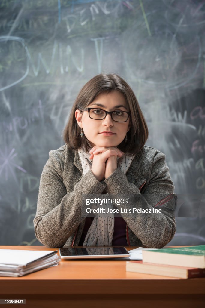 Caucasian student sitting at desk