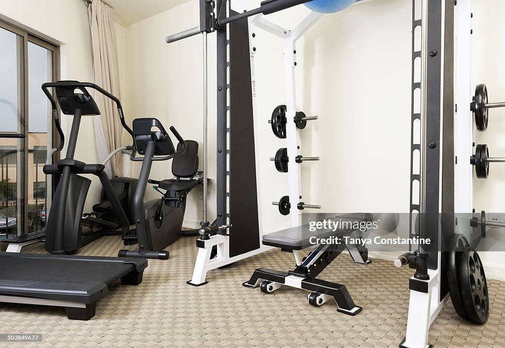 Weights and exercise machines in gym