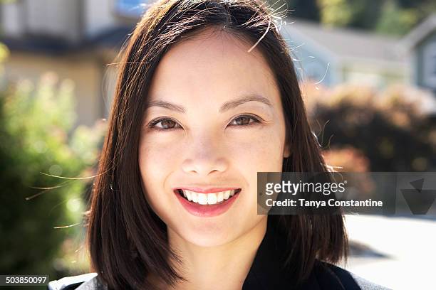 filipino woman smiling outdoors - beautiful filipino women stock pictures, royalty-free photos & images
