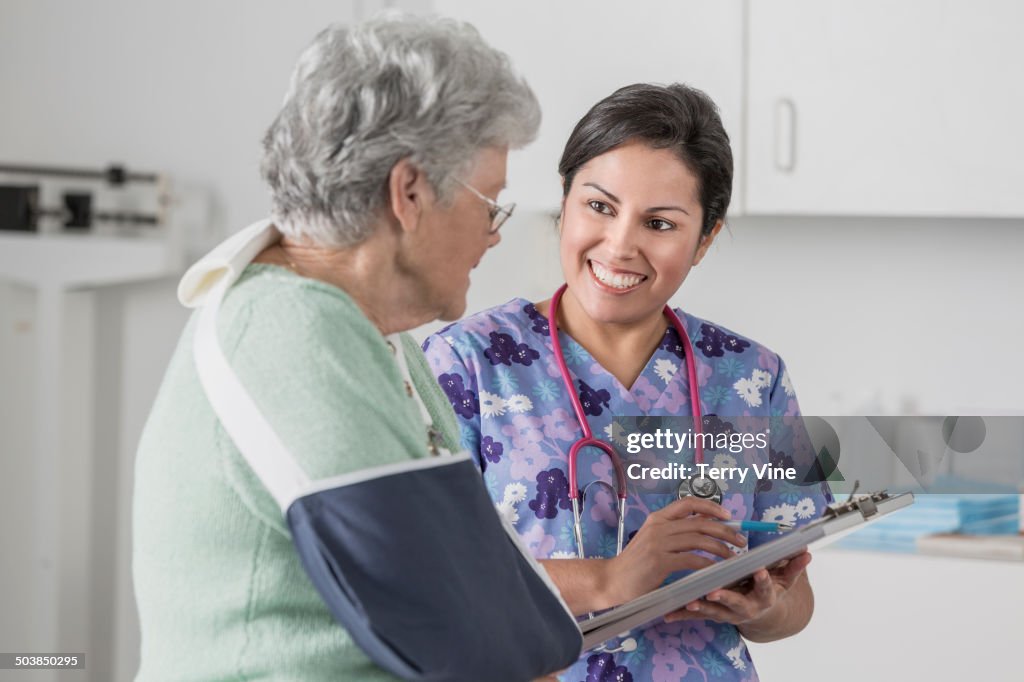 Nurse and patient talking in doctor's office