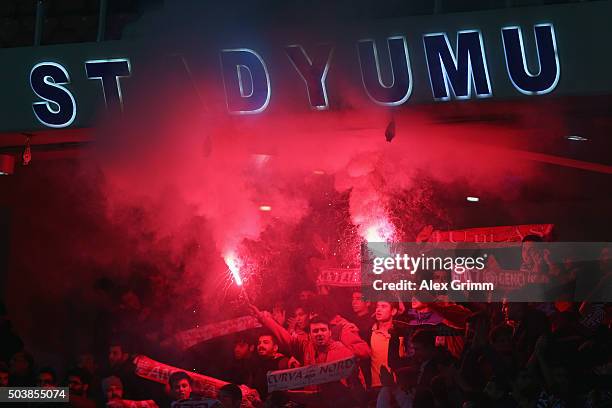 Fans of Antalyaspor burn flares during a friendly match between VfB Stuttgart and Antalyaspor at Akdeniz Universitesi on January 7, 2016 in Antalya,...