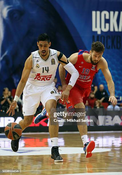 Gustavo Ayon, #14 of Real Madrid competes with Joel Freeland, #19 of CSKA Moscow in action during the Turkish Airlines Euroleague Basketball Top 16...