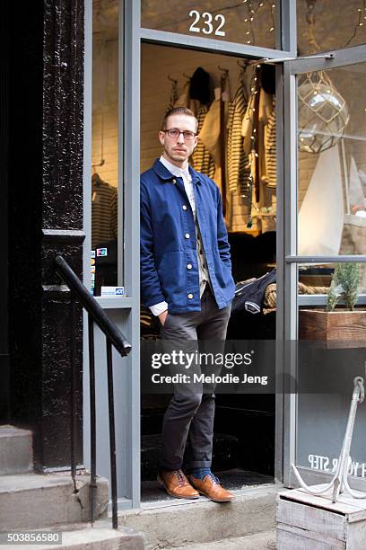 Ryan Lentz wears an Armor Lux blue navy buttoned fishermen jacket brown oxford shoes and blue shoelaces in Nolita on December 01, 2015 in New York...