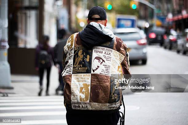 Man wears a Tupac rapper-themed jacket in Soho on December 01, 2015 in New York City.