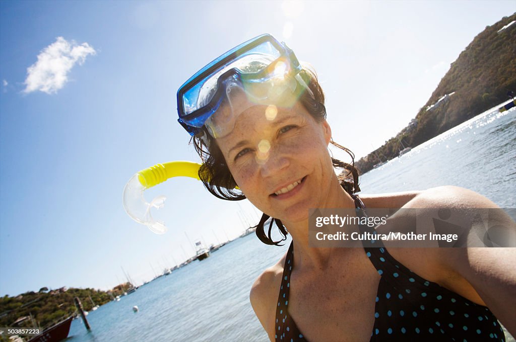 Mid Age woman with snorkeling gear