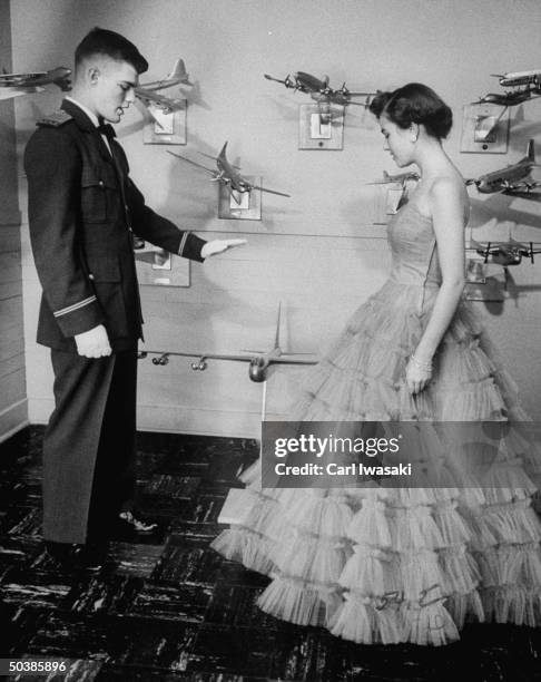 Air Force Academy cadet explaining flying technique to his date.