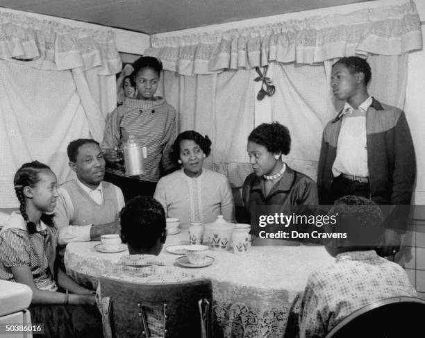 Autherine Lucy , first African American to enter the University of Alabama, with family of brother-inlaw. Her challenge to school segregation was met...