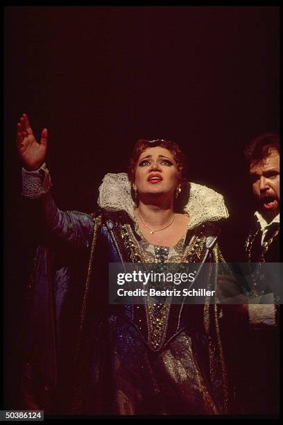 Russian mezzo soprano Olga Borodina singing the role of Princess Marina in Mussorgsky's Boris Godunov on stage at the Metropolitan Opera.