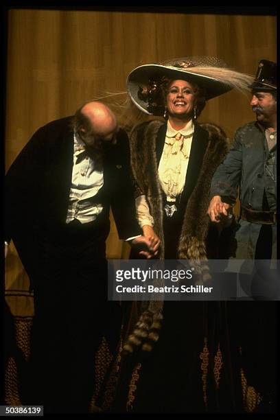 Soprano Kiri Te Kanawa as Rosalinde, taking a curtain call w. Two unident. Singers during performance of the comic opera Die Fledermaus on stage at...