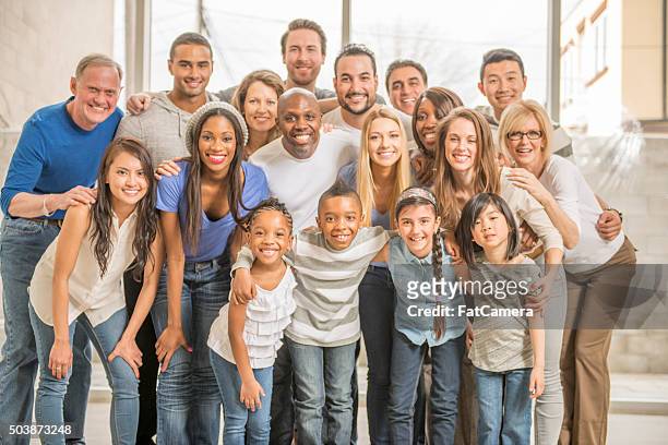 happy group at a family reunion - filipino family reunion stock pictures, royalty-free photos & images