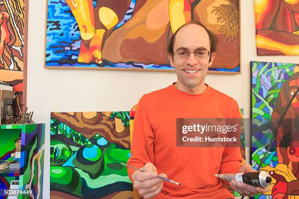 portrait of an artist with aspergers in his studio - aspergers stock pictures, royalty-free photos & images