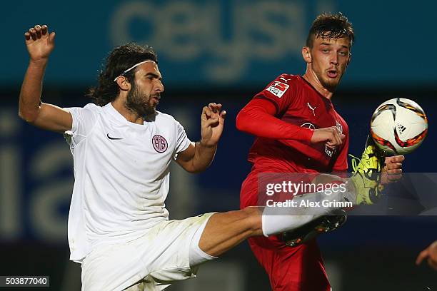 Sakib Aytac of Antalyaspor is challenged by Borys Tashchy of Stuttgart during a friendly match between VfB Stuttgart and Antalyaspor at Akdeniz...