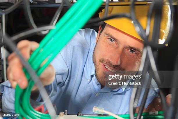 network engineer bundling cable for structured cabling - tomada de ligação à rede imagens e fotografias de stock