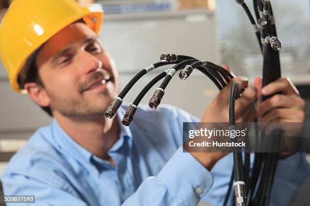 network engineer preparing structured cabling for data center - tomada de ligação à rede imagens e fotografias de stock