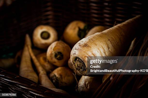 parsnips in a basket - pastinaak stockfoto's en -beelden