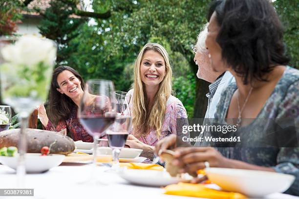 people on a garden party - wine enjoyment stock pictures, royalty-free photos & images