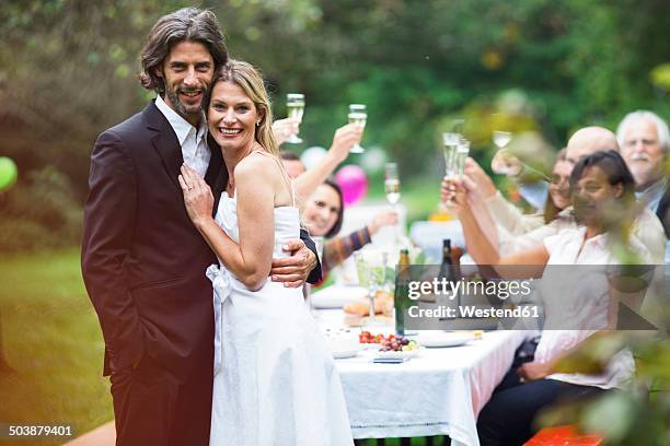 bride and groom on a garden party - 70s wedding black couple stock pictures, royalty-free photos & images