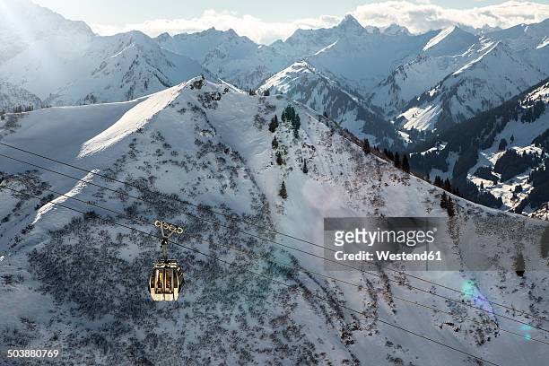austria, vorarlberg, riezlern, mountainscape with cable car in winter - riezlern imagens e fotografias de stock