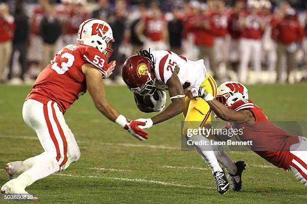 Edwards and Sojourn Shelton of the Wisconsin Badgers tackles Ronald Jones II of USC Trojans in a Wisconsin 23-21 win during the National University...