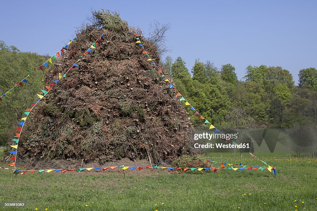 Germany, North Rhine-Westphalia, Detmold, Woodpile for easter fire, decorated with pennants