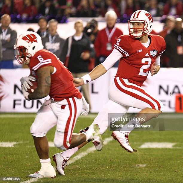 Joel Stave hands of the ball to Corey Clement of the Wisconsin Badgers during 23-21 Wisconsin win against the USC Trojans during the National...