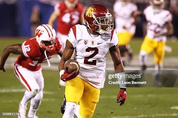 Adoree' Jackson of the USC Trojans carries the ball against Wisconsin Badgers during the National University Holiday Bowl at Qualcomm Stadium on...