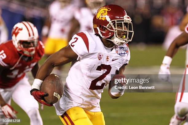 Adoree' Jackson of the USC Trojans carries the ball against Wisconsin Badgers during the National University Holiday Bowl at Qualcomm Stadium on...