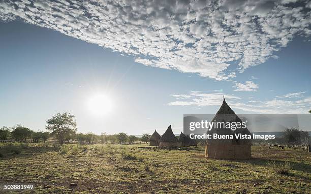 conic huts in a himba village - opuwo stock pictures, royalty-free photos & images