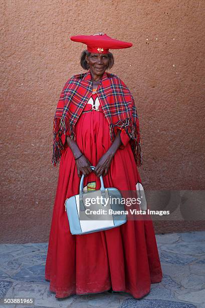 herero woman with traditional dress - opuwo tribe foto e immagini stock