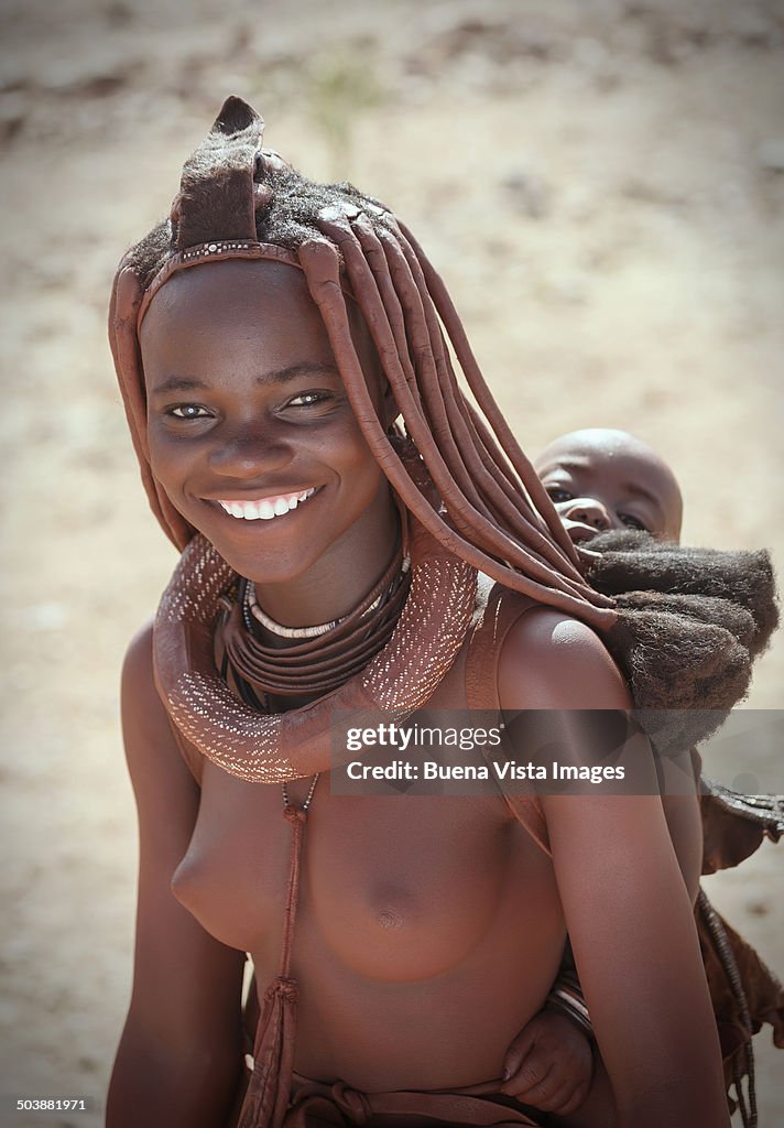Himba mother with her little child