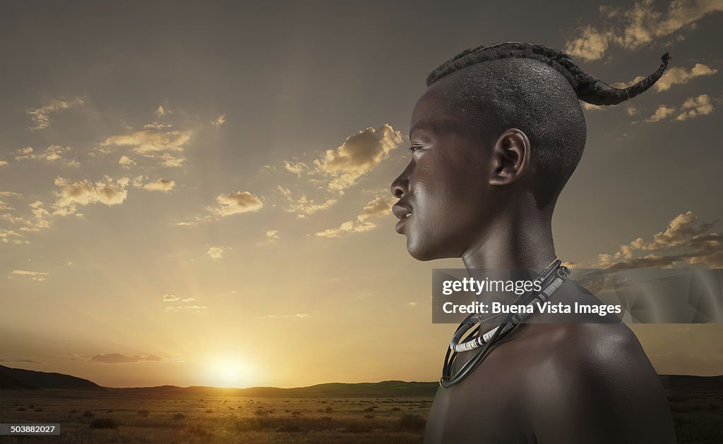 Young Himba man at sunset