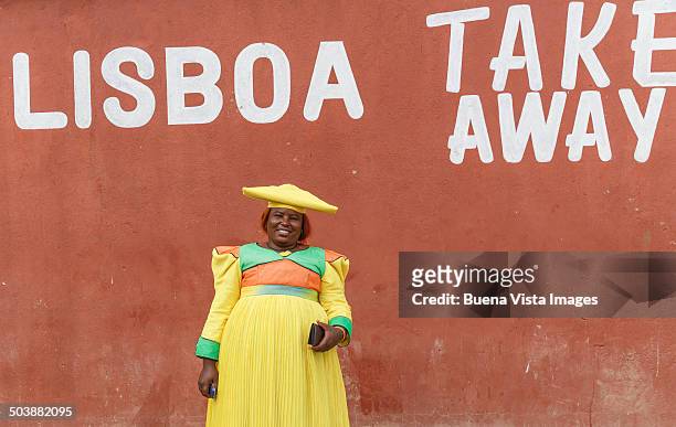 herero woman with traditional dress - opuwo tribe stock-fotos und bilder
