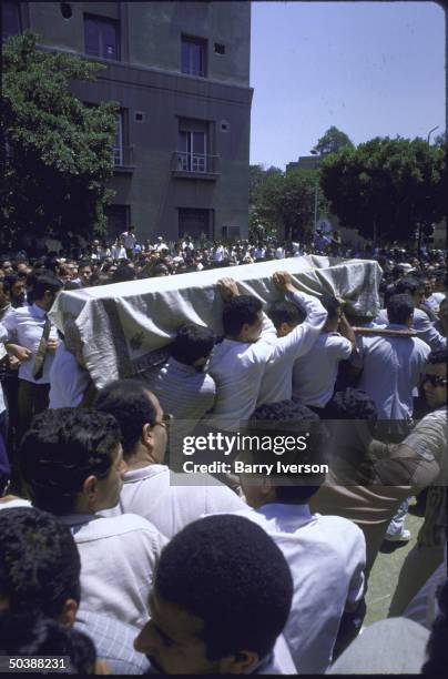 Funeral procession for Egyptian Moslem Brotherhood Ldr. Omar El-Telmissani with Moslem Brotherhood members and supporters surrounding and carrying...