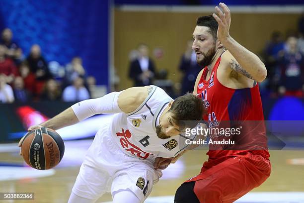 Nikita Kurbanov of CSKA Moscow vies with Andrés Nocioni of Real Madrid during the Turkish Airlines Euroleague Top 16 match between CSKA Moscow and...
