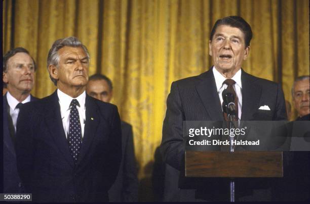 Pres. Ronald W. Reagan with Australian PM Robert J. L. Hawke and WH Chief of Staff Donald T. Regan .