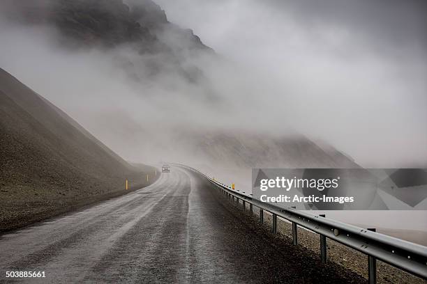 foggy mountain pass - foggy road stock pictures, royalty-free photos & images