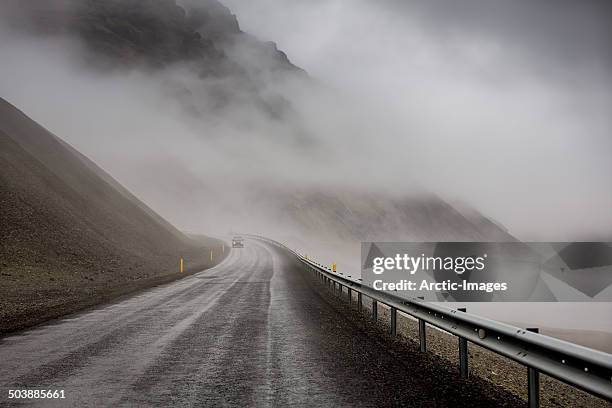 foggy mountain pass - mountain pass stock pictures, royalty-free photos & images