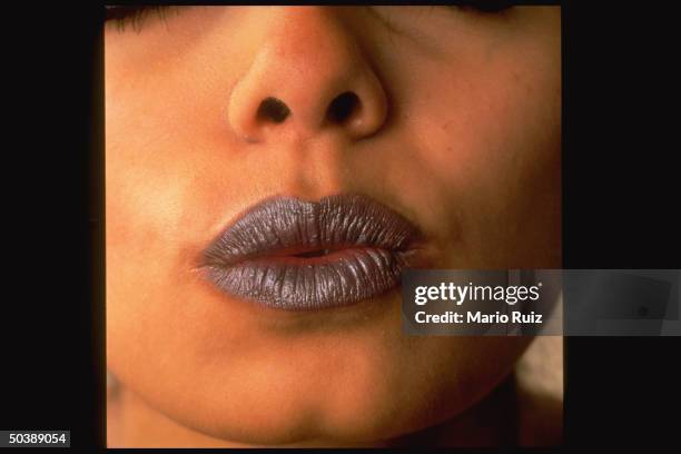 Closeup of model's pursed mouth w. Bruise lipstick by Urban Decay cosmetics company.