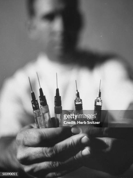 Hypodermic needles containing new measles vaccines.