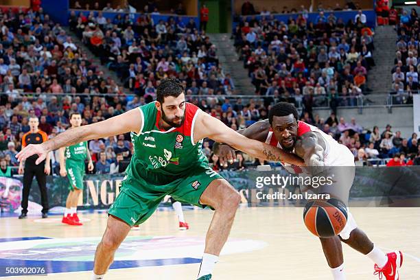 Ioannis Bourousis, #9 of Laboral Kutxa Vitoria Gasteiz competes with D.J. Strawberry, #8 of Olympiacos Piraeus during the Turkish Airlines Euroleague...