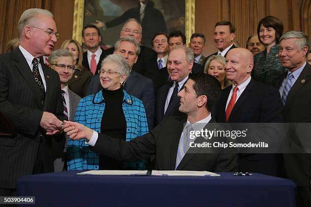 Speaker of the House Paul Ryan hands the pen he signed legislation to repeal the Affordable Care Act, also known as Obamacare, and to cut off federal...